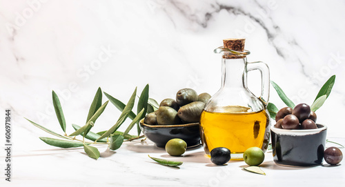 olives berries in wood bowls and oil in glass bottles on a light background. Healthy and detox food concept. Long banner format. top view