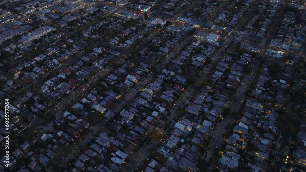 Row of houses along streets in residential urban neighbourhood from heights. City at night. Row of houses along streets in residential urban neighbourhood from heights. City at night.