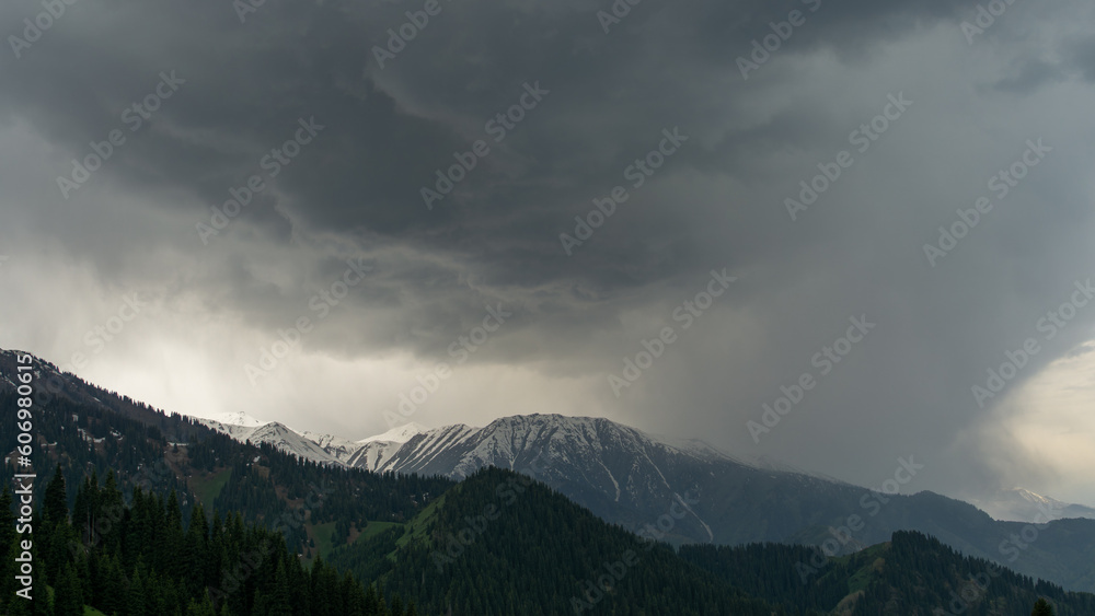 cloudy weather in the mountains. black clouds over mountain peaks. storm