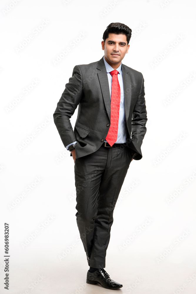 Young indian businessman in classic suit giving expression. Young indian businessman in classic suit giving expression.