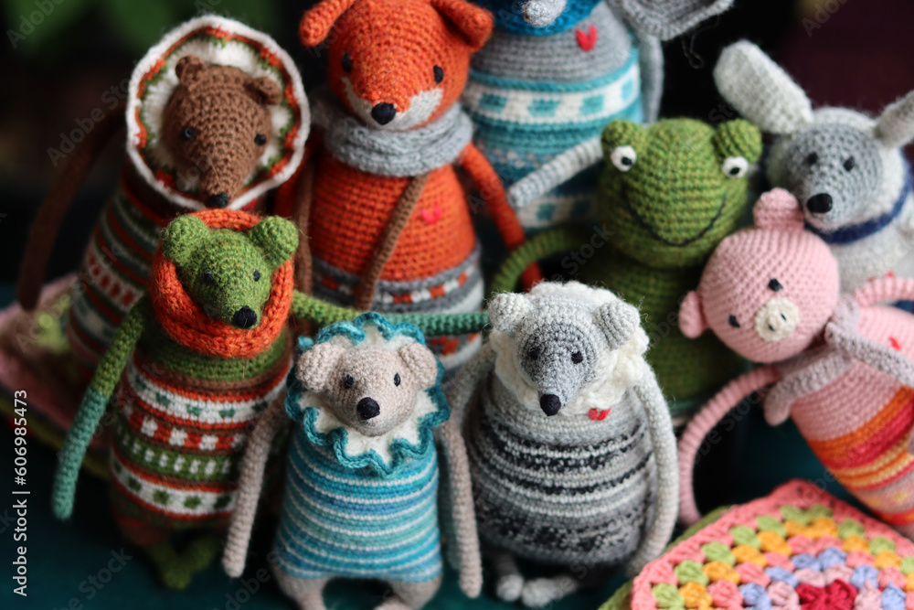 Crochet stuffed animals close up photo. Hand made Amigurumi toys on dark background with copy space. Cute crochet gift. Crochet stuffed animals close up photo. Hand made Amigurumi toys on dark background with copy space. Cute crochet gift.