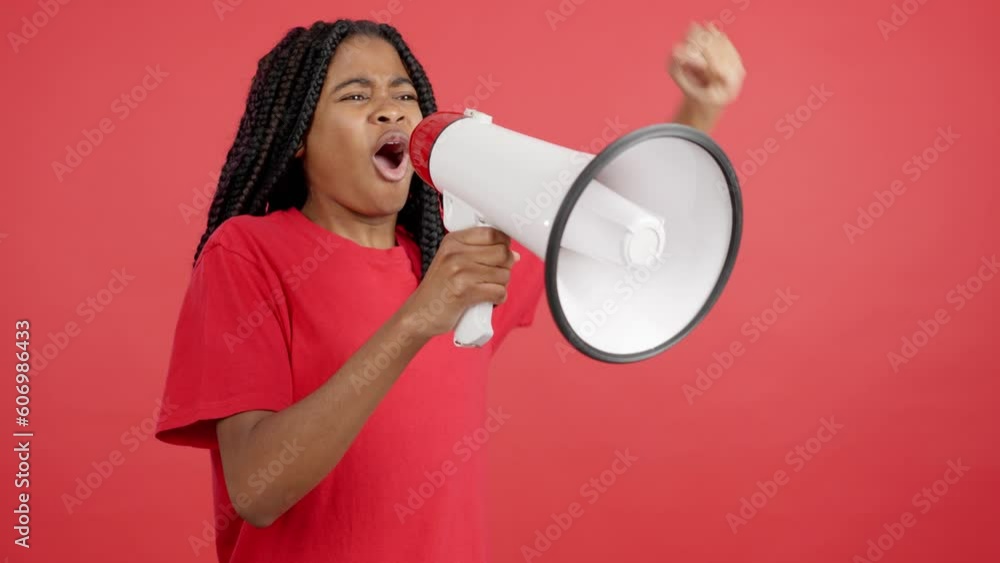 Upset african woman yelling using a loudspeaker Upset african woman yelling using a loudspeaker