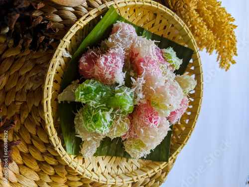 Cenil is a typical Javanese food made from cassava starch and colored and sprinkled with grated coconut. This food has a chewy texture and sweet taste