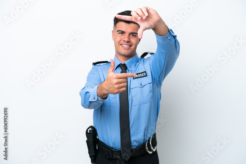 Young police caucasian man isolated on white background focusing face. Framing symbol