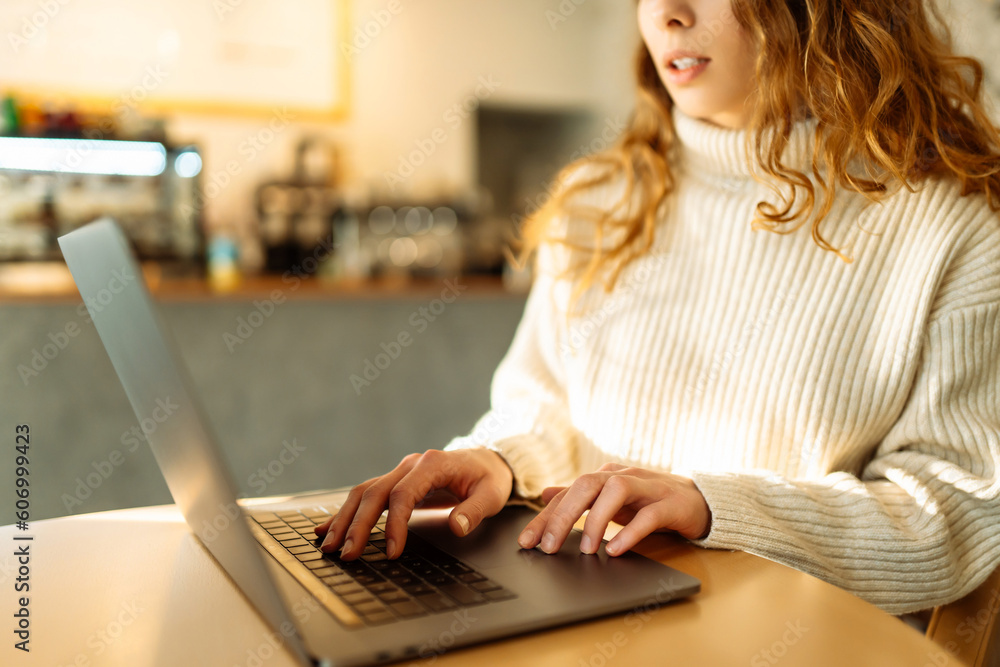 Female hands working on a laptop, close-up. Business, technology, internet and networking concept. Female hands working on a laptop, close-up. Business, technology, internet and networking concept.