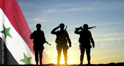 Silhouettes of a soldiers against the sunset with Syria flag. EPS10 vector