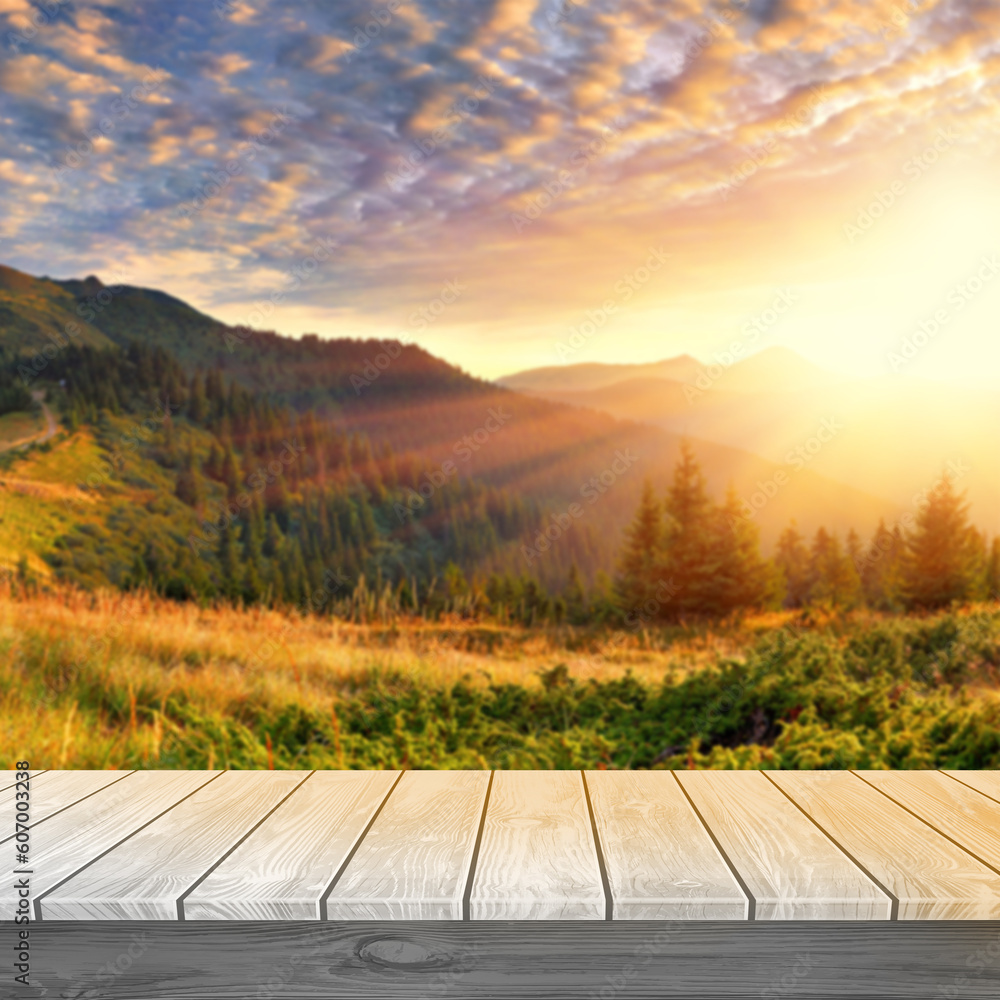 white wood table top with blurred forest sunset background 