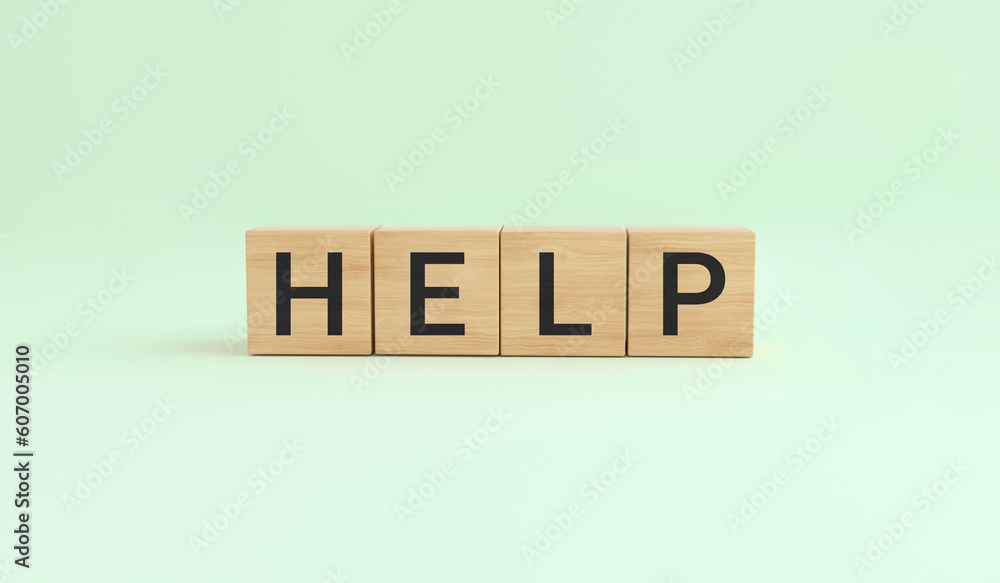 Concept word help on wooden cubes on green background. Concept word help on wooden cubes on green background.