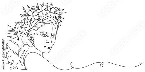 Women’s day line art style vector illustration. Line art vector illustration of a woman face with flower in hair photo