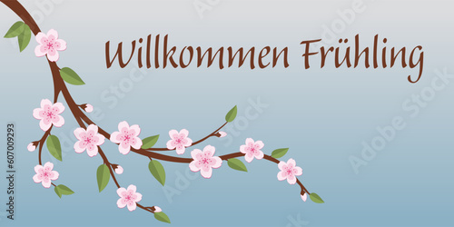 Willkommen Frühling - Schriftzug in deutscher Sprache. Grußbanner mit einem Kirschblütenzweig.