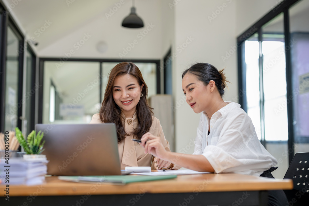 Two business women sit and discuss plans for a new project. Brainstorm and share ideas. Two business women sit and discuss plans for a new project. Brainstorm and share ideas.