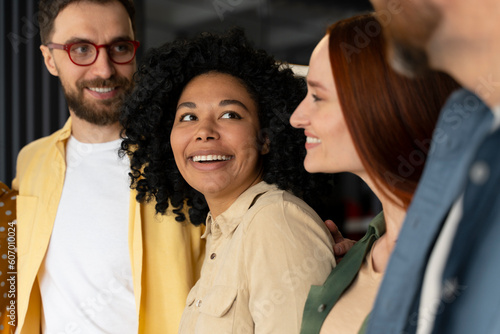 Close-up portrait of a happy business people smiling cheerfully during a meeting in creative office.