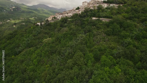 Little typical village up a mountain and green valley in the Abruzzo region of Italy