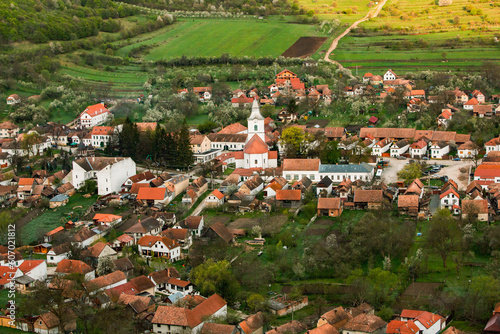 Rimetea is a small village located in Transylvania, Romania. It is situated in the Apuseni Mountains and is known for its picturesque setting and well preserved Hungarian architectural style. photo