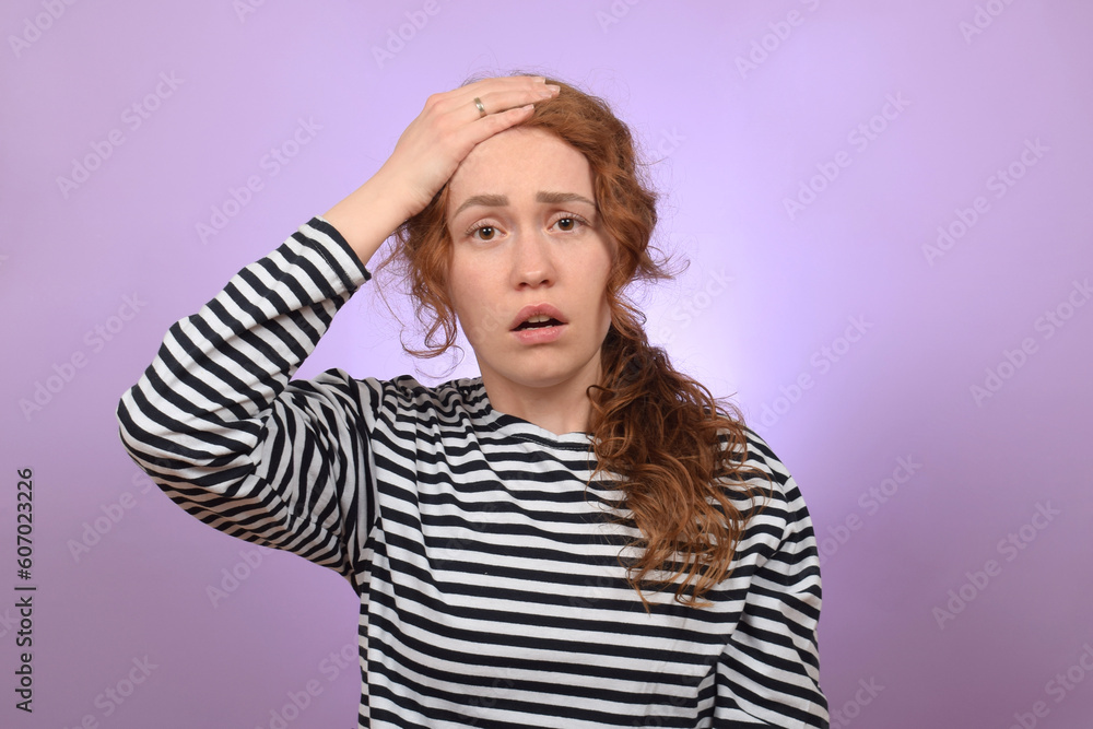portrait of a young red-haired woman with a headache portrait of a young red-haired woman with a headache