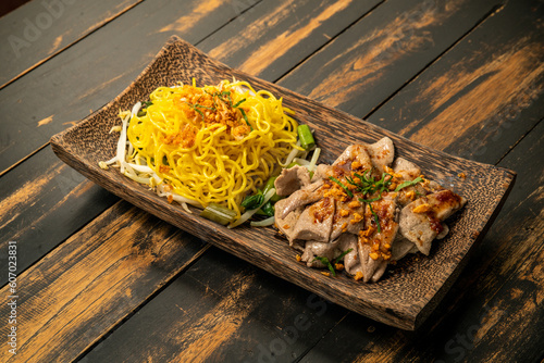 Delicious yellow noodles with pork and beef