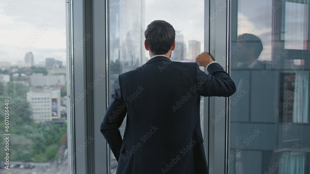 Confident director crossing hands standing office window closeup. Manager work. Confident director crossing hands standing office window closeup. Manager work.