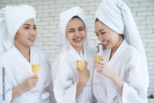 three asian female at bedroom