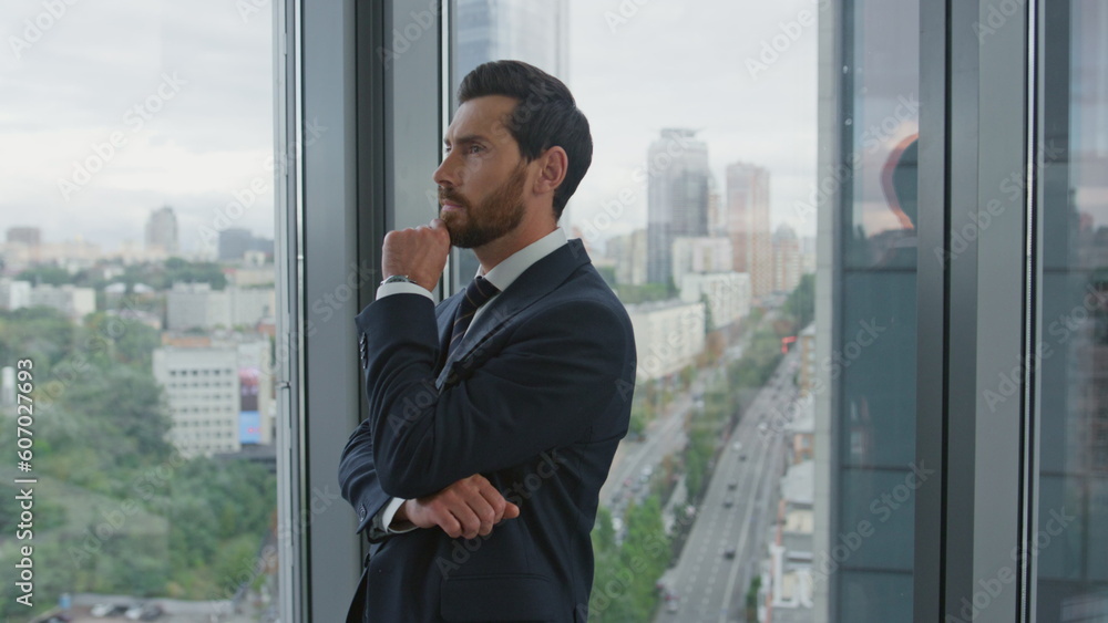 Office manager thinking business ideas near window with cityscape close up. Office manager thinking business ideas near window with cityscape close up.