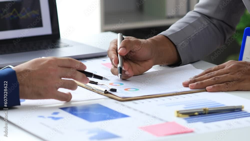 The sales department is having a monthly summary meeting to bring it to the department manager, they are verifying the correctness of the documents that are prepared before bringing in to the manager The sales department is having a monthly summary meeting to bring it to the department manager, they are verifying the correctness of the documents that are prepared before bringing in to the manager