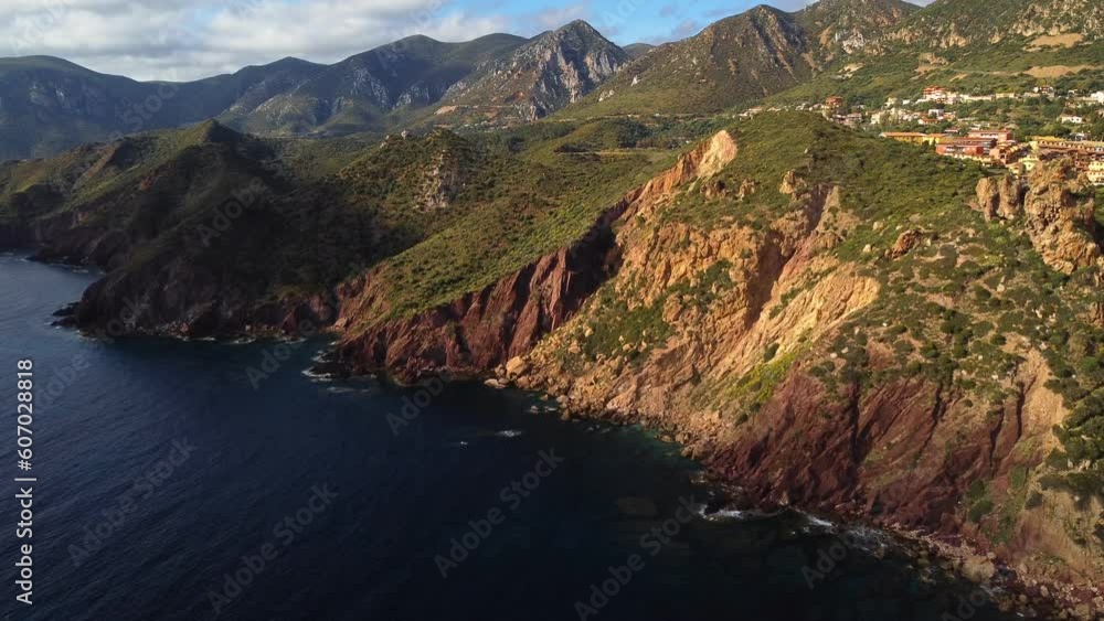 Sardinia coast, epic rugged steep cliffs in Masua, South Sardinia, aerial Sardinia coast, epic rugged steep cliffs in Masua, South Sardinia, aerial
