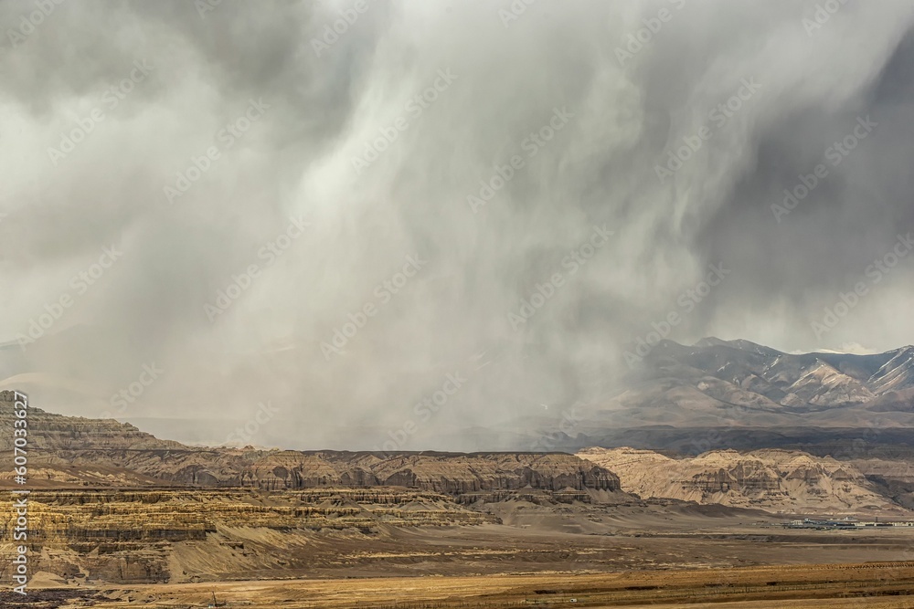 View of cliffs during the sandstorm. Earth forest landform in Zanda County, Tibet, China.