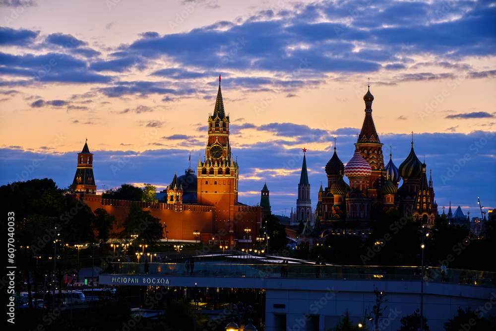 Spasskaya Tower and St Basil Cathedral are illuminated in evening.