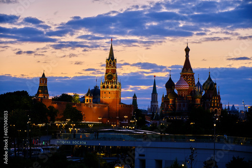 Spasskaya Tower and St Basil Cathedral are illuminated in evening.
