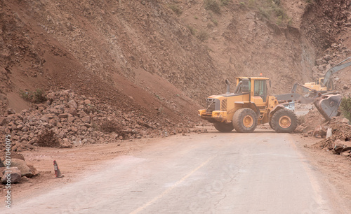 Road workers paving a new mountain road - Atlas mountains, Morocco