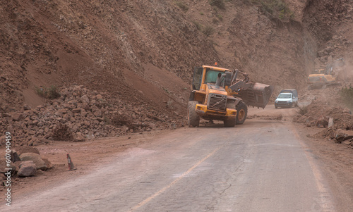Road workers paving a new mountain road - Atlas mountains, Morocco