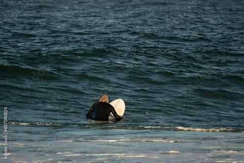 Surfer at Bondi Beach, Australia, on Saturday morning having fun and catching waves