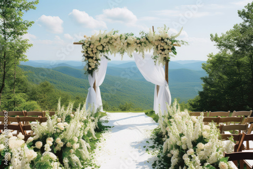 Structured all white chuppah on an elevated hill overlooking appalachian mountains photo