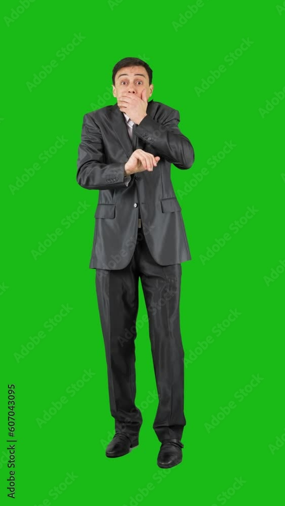 Man covering mouth in studio. Chroma key Man covering mouth in studio. Chroma key
