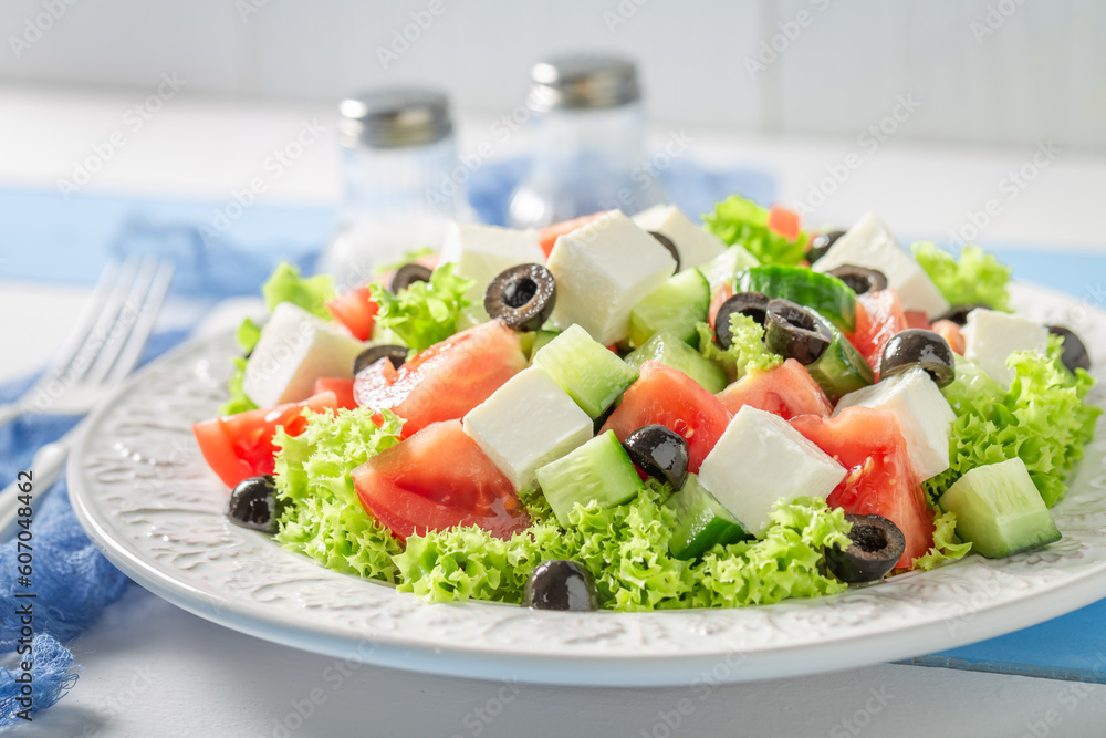 Fresh and healthy Greek salad with olives, feta and lettuce.