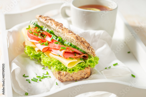 Tasty and fresh sandwich with ham  cheese and chive.