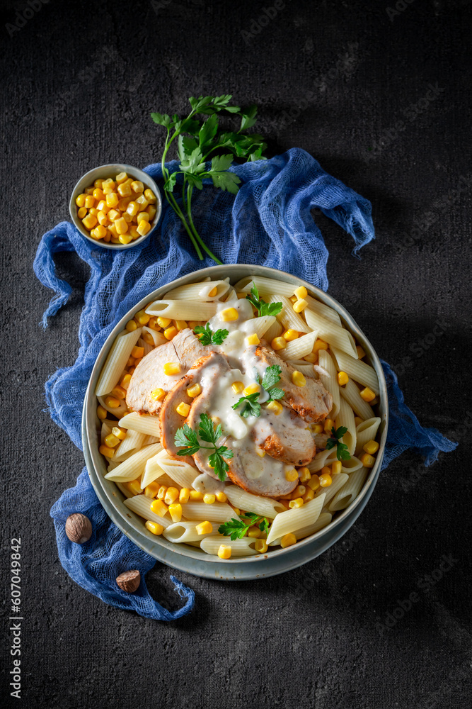 Fresh and delicious penne with bechamel sauce and corn.