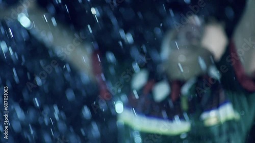 A child's joy in slow motion rain
