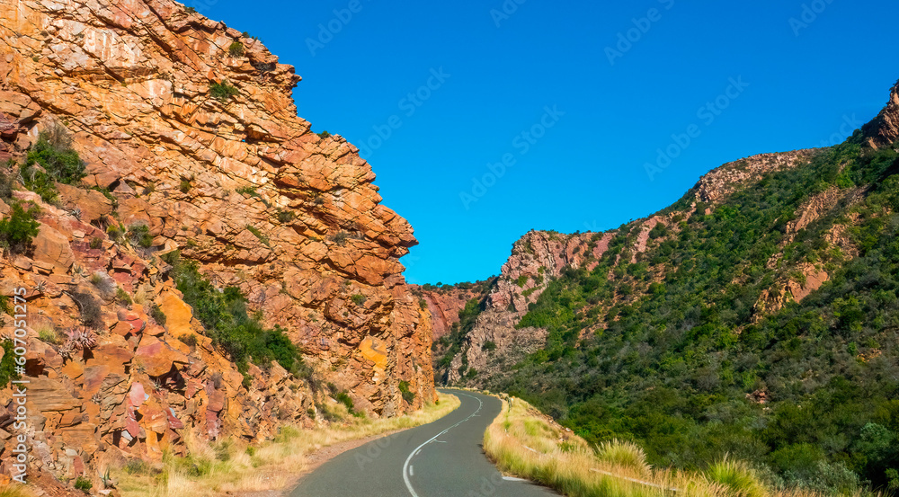 Steep-sided mountains. Waaipoort mountain pass situated between Steytlerville and Jansenville passes through the steep-sided Baviaans mountains, presenting spectacular geological scenery.