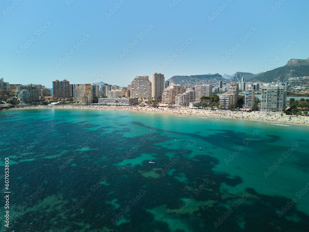 Costa Blanca coast.
View from sea. Beautiful beach and town of Calp, Spain.