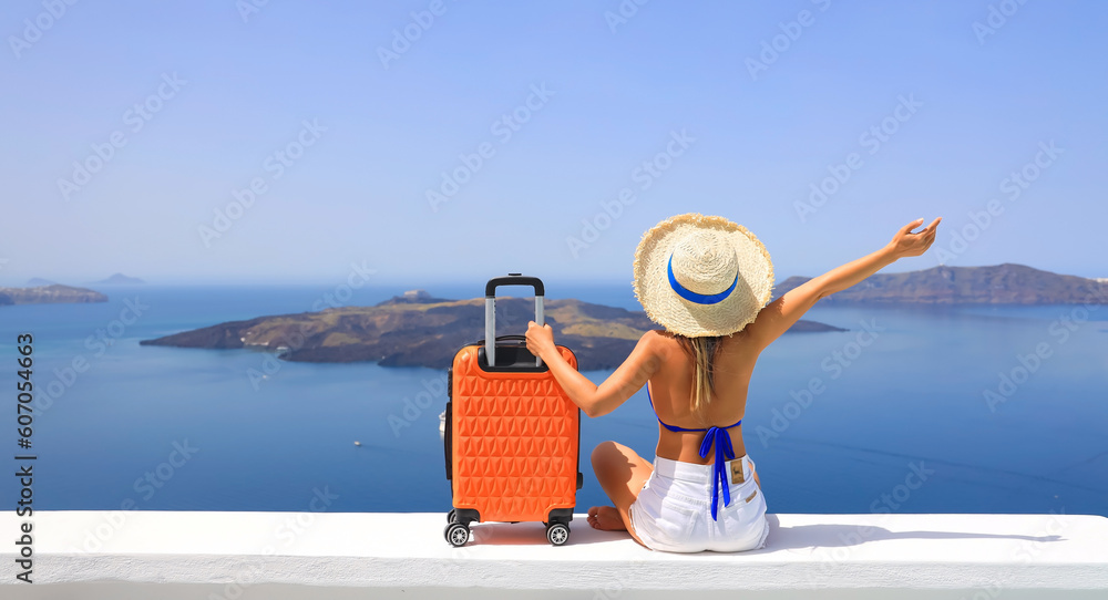 Happy moment with young woman tourist as orange the luggage in Santorini island,Greece - obrazy, fototapety, plakaty 