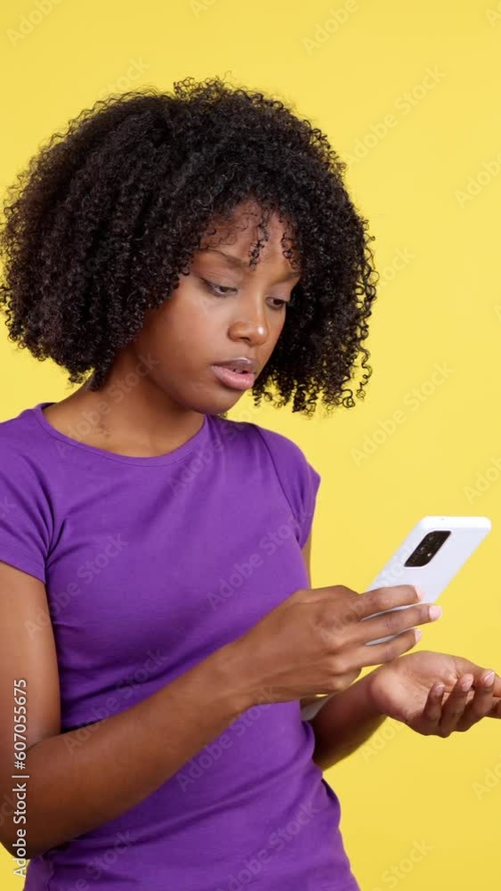 Angry african woman looking at the mobile Angry african woman looking at the mobile