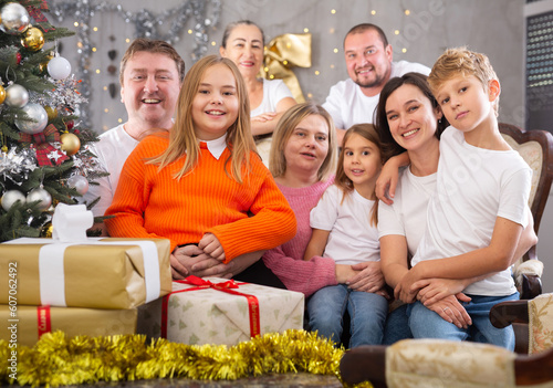 Family with children on sofa in christmas interior