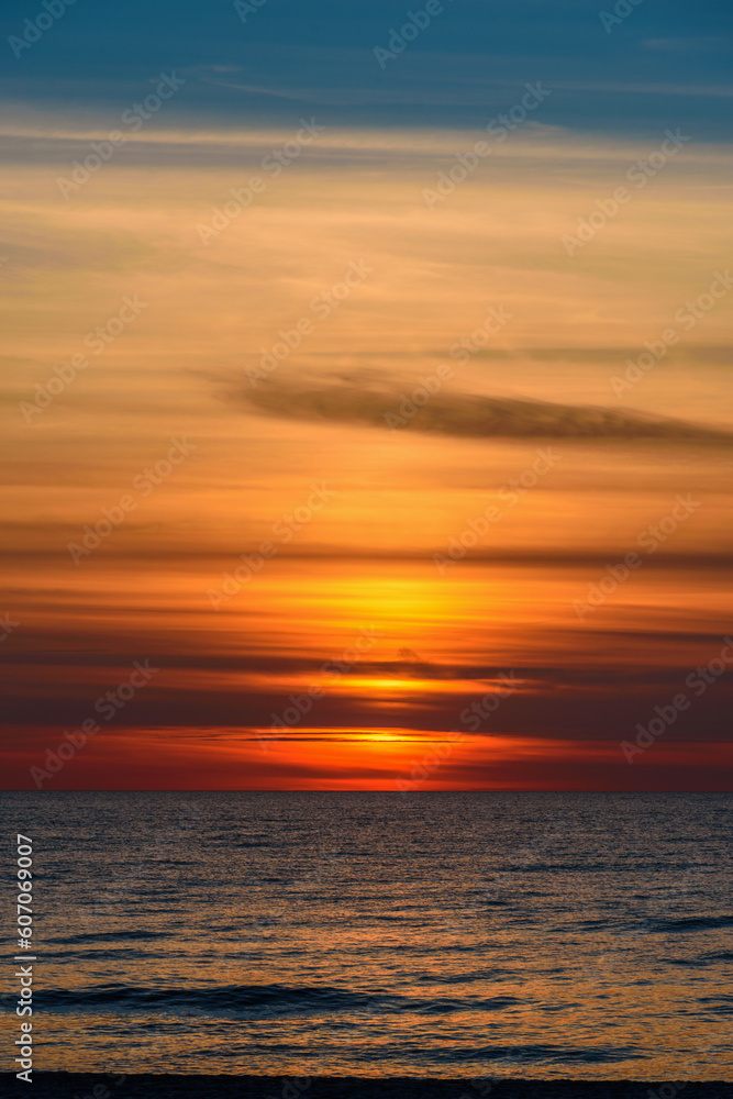 Spectacular bright golden sunset over Baltic sea