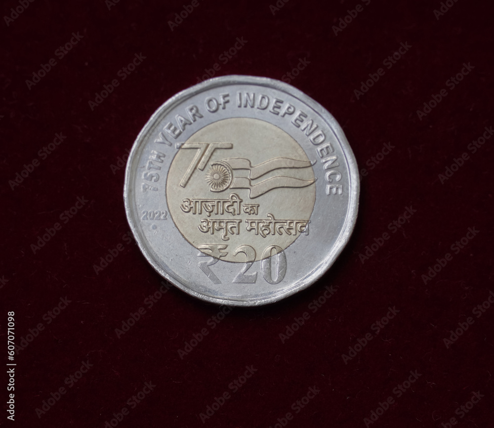 selective focus view of a new twenty Rupee Indian Coin released in 2022 commemorates
 75 years of Indian independence (Azadi ka Amrit Mahotsav)  - obrazy, fototapety, plakaty 