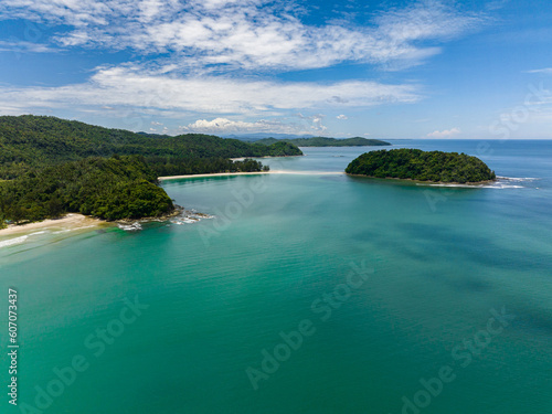 Aerial view of tropical beach with crystal clear water in the tropics. Borneo, Malaysia.