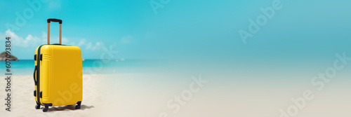 Banner of yellow modern suitcase with small wheels standing on the turquoise sea on the sand. Summer concept  travel  flight  vacation  seaside holidays. Copy space  place for text