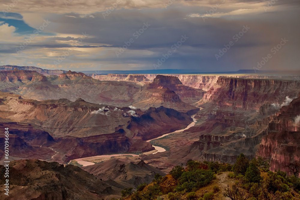 The Colorado River seen in the late afternoon light on a stormy summer day at Navajo Point on the south rim of the Grand Canyon, Arizona, USA.
