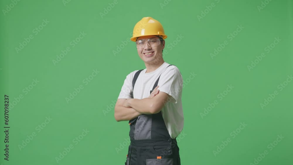 Side View Of Asian Man Worker Wearing Goggles And Safety Helmet Smiling And Crossing His Arms While Standing In The Green Screen Background Studio
Side View Of Asian Man Worker Wearing Goggles And Safety Helmet Smiling And Crossing His Arms While Standing In The Green Screen Background Studio