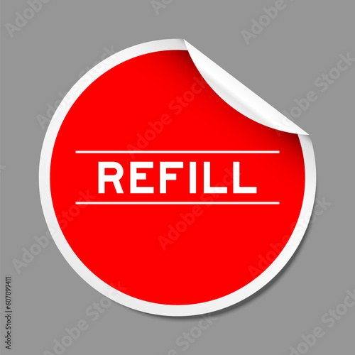 Red color peel sticker label with word refill on gray background