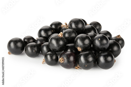 Ripe blackcurrant berries are scattered, isolated on a white background.